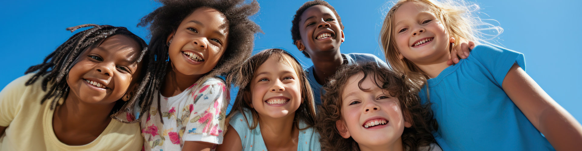diverse group of children, ranging in age and ethnicity